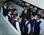 Principal Gennadiy Kim with some of the pupils